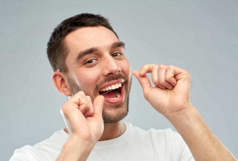 Young Men Cleaning his teeths